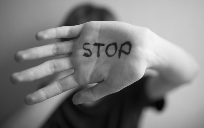Hand with 'Stop' written on Palm to Show Statement Against gender-based violence